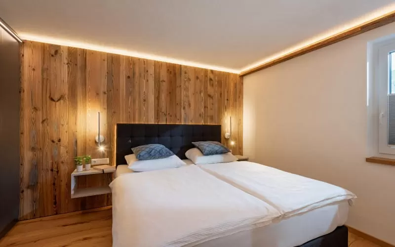 haus_rass_stoecklfeld_18_kirchberg_09_2024_appartement_sonnberg_schlafzimmer.jpg