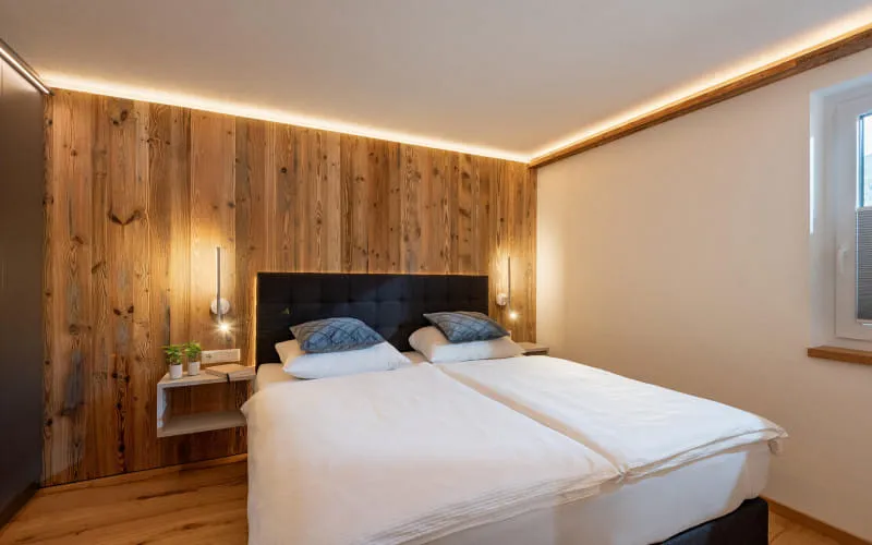 haus_rass_stoecklfeld_18_kirchberg_09_2024_appartement_sonnberg_schlafzimmer.jpg